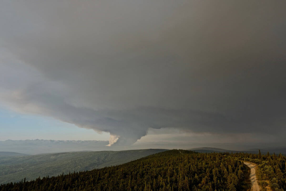 A column of wildfire smoke is seen from the Midnight Dome fire lookout tower near Dawson City on Aug. 2, 2022. (Submitted/Government of Yukon)