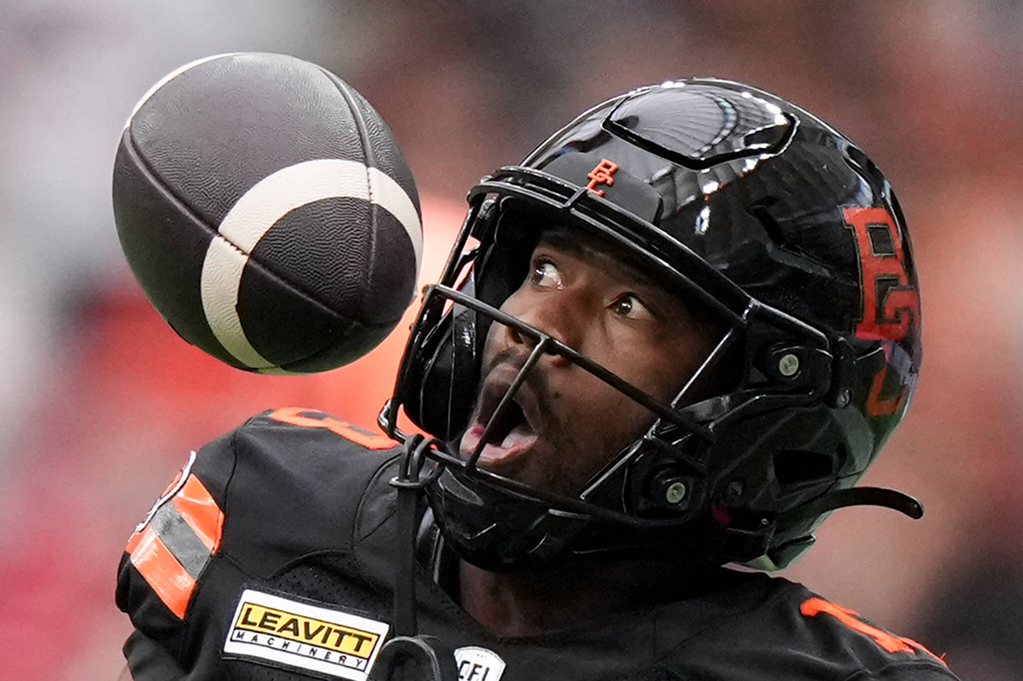 B.C. Lions’ Alexander Hollins bobbles the ball and fails to make the catch during the first half of a CFL football game against the Calgary Stampeders, in Vancouver, on Saturday, June 15, 2024. THE CANADIAN PRESS/Darryl Dyck