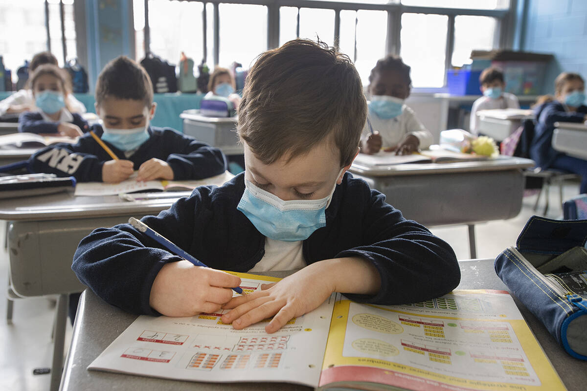 Grade one students wear masks as they attend class at Honore Mercier elementary school, Tuesday, March 9, 2021 in Montreal.THE CANADIAN PRESS/Ryan Remiorz