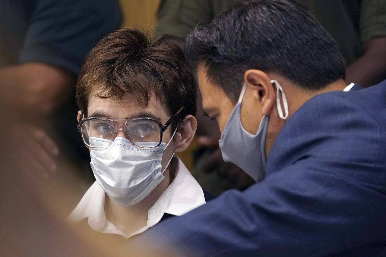 Parkland school shooter Nikolas Cruz sits at the defense table with defense attorney David Wheeler before pleading guilty, Friday, Oct. 15, 2021, at the Broward County Courthouse in Fort Lauderdale, Fla., on all four criminal counts stemming from his attack on a Broward County jail guard in November 2018, Cruz's lawyers said Friday that he plans to plead guilty to the 2018 massacre at a Parkland high school. (Amy Beth Bennett/South Florida Sun Sentinel via AP, Pool)