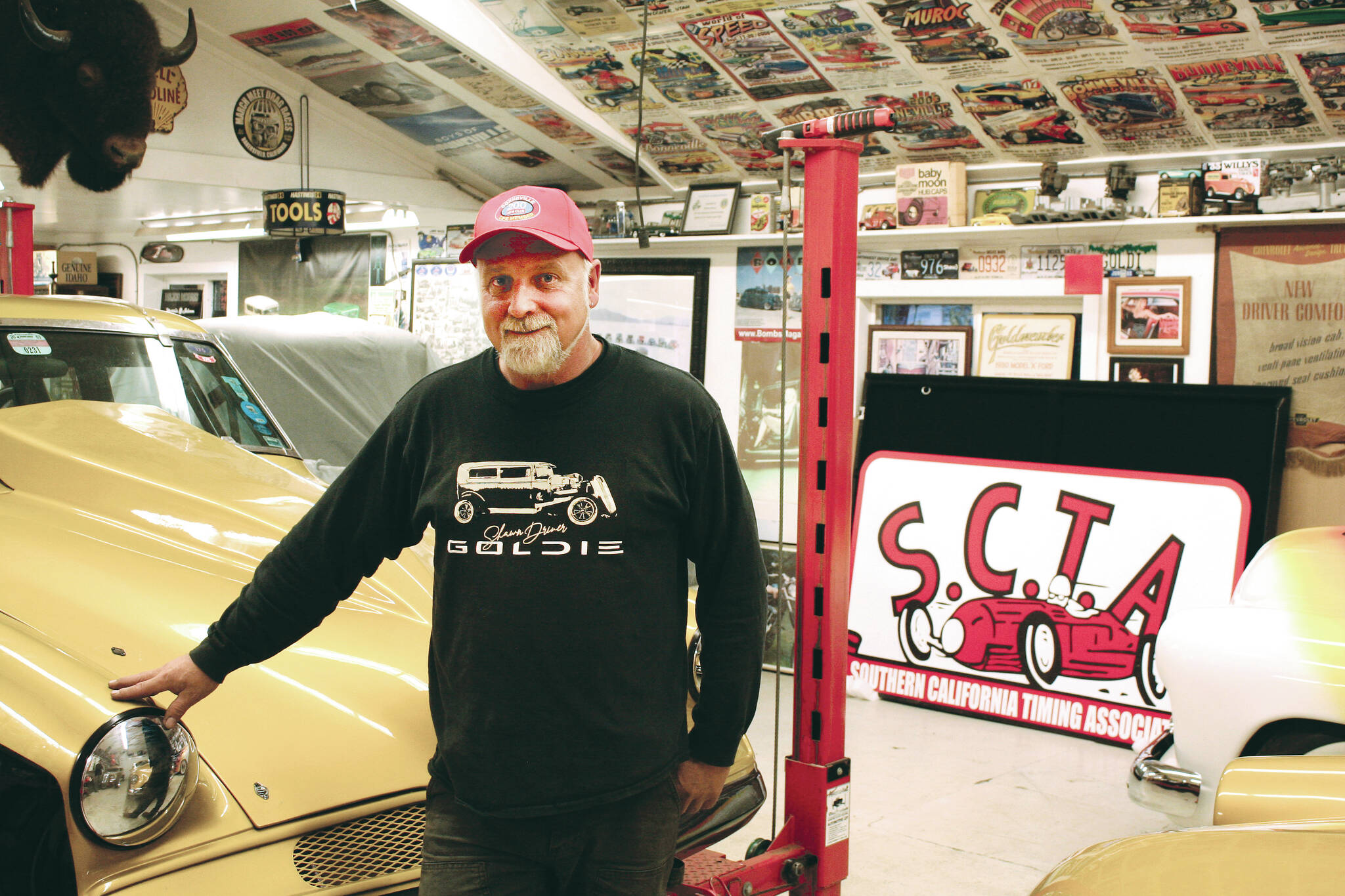 Shawn Driver proudly stands next to his in Sooke shop. (Bailey Moreton - Sooke News Mirror)