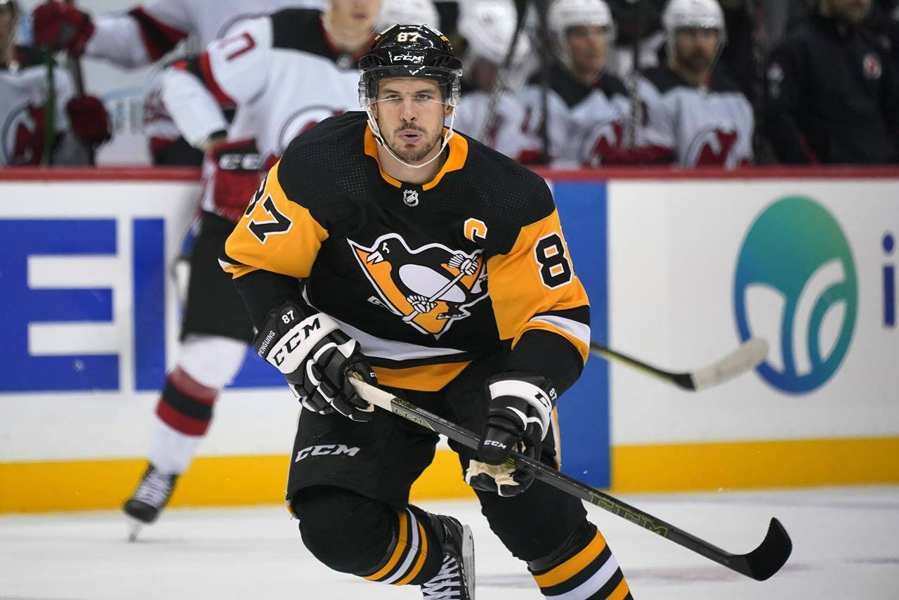 Pittsburgh Penguins’ Sidney Crosby (87) skates during the second period of the team’s NHL hockey game against the New Jersey Devils in Pittsburgh, Saturday, Oct. 30, 2021. It is Crosby’s first game this season, after his recovery from wrist surgery. (AP Photo/Gene J. Puskar)