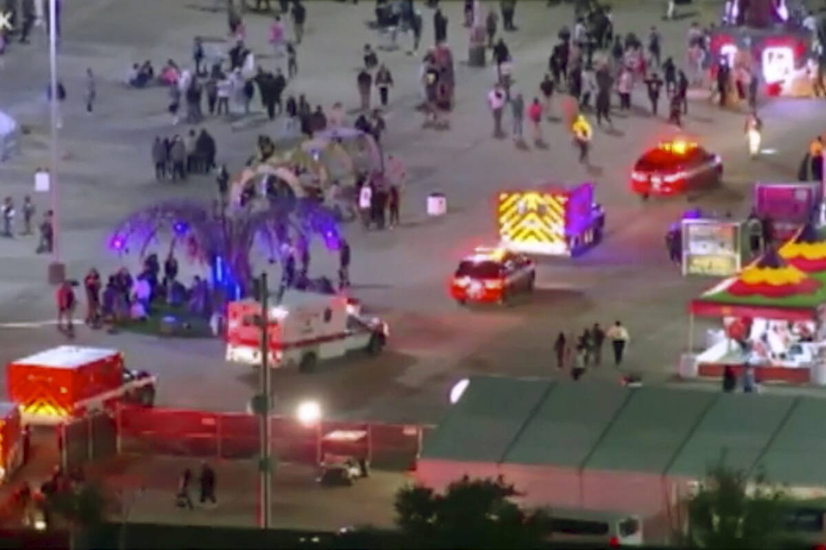 Emergency personnel respond to the Astroworld music festival in Houston on Friday, Nov. 5, 2021. Several people died and numerous others were injured in what officials described as a surge of the crowd at the music festival while Travis Scott was performing. Officials declared a ‚Äúmass casualty incident‚Äù just after 9 p.m. Friday during the festival where an estimated 50,000 people were in attendance, Houston Fire Chief Samuel Pev±a told reporters at a news conference. (KTRK via AP)