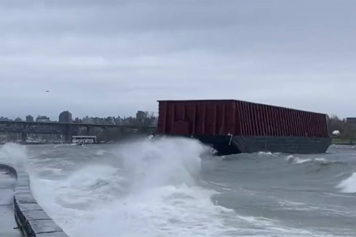 An unmoored barge appears to have run aground at Vancouver’s Sunset Beach on Monday, Nov. 15, 2021. (Jorge Amigo)