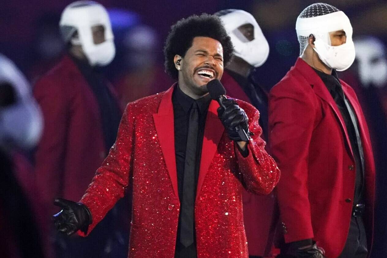 FILE - The Weeknd performs during the halftime show of the NFL Super Bowl 55 football game between the Kansas City Chiefs and Tampa Bay Buccaneers, on Feb. 7, 2021, in Tampa, Fla. The Weeknd is nominated for six American Music Awards, including one for artist of the year. (AP Photo/Ashley Landis, File)