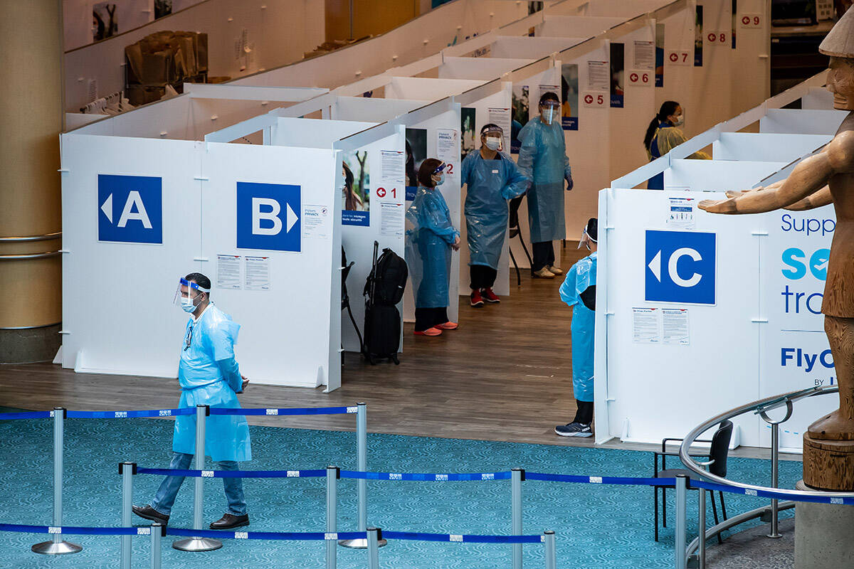 FILE – A COVID-19 rapid testing area is seen on the international arrivals level at Vancouver International Airport, in Richmond, B.C., on Friday, July 30, 2021. THE CANADIAN PRESS/Darryl Dyck