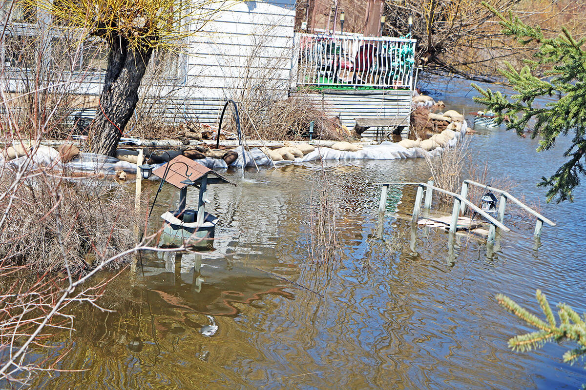 FILE - Flooding this past spring forced many houses in the Houseman Subdivision to erect makeshift barricades from sandbags to hold back the water. (Patrick Davies photo)