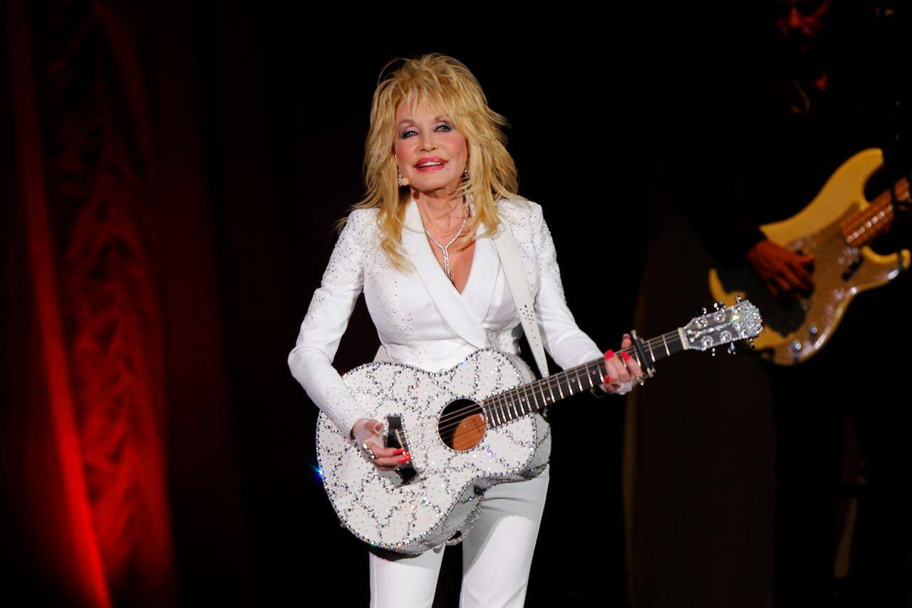 FILE - Dolly Parton performs in concert on July 31, 2015, in Nashville, Tenn. Parton is among this year’s first time nominees for induction into the Rock & Roll Hall of Fame. (Photo by Wade Payne/Invision/AP, File)