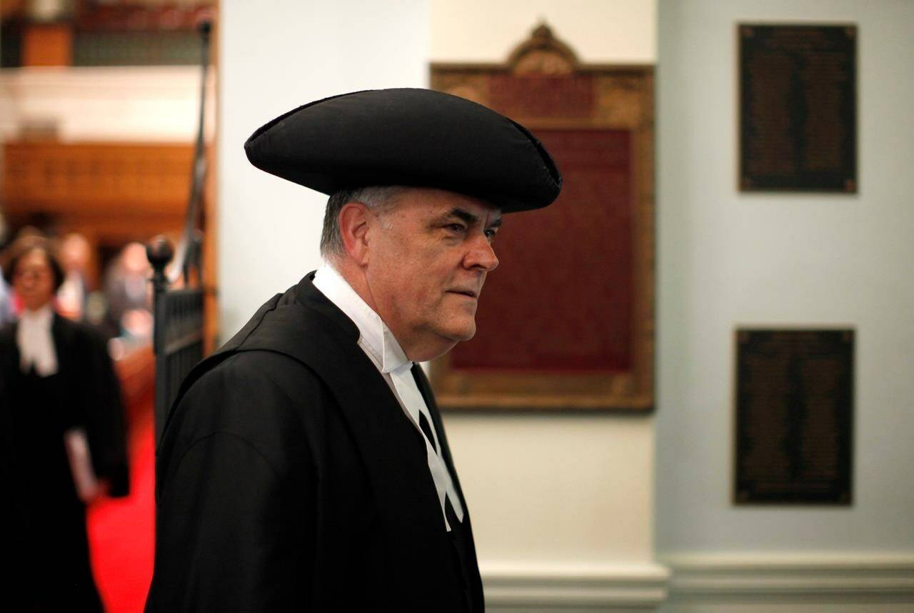 Speaker of the House Darryl Plecas walks by at the provincial Legislature in Victoria, Oct. 24, 2019. THE CANADIAN PRESS/Chad Hipolito