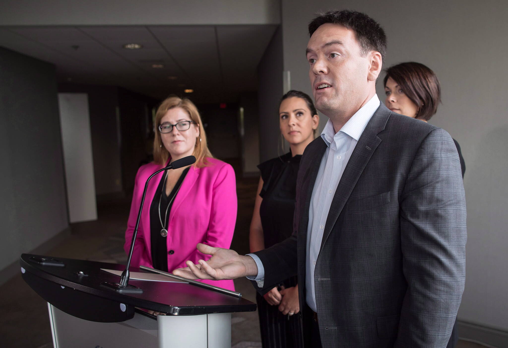 NDP member of parliament Alistair MacGregor, front right, responds to questions on Wednesday September 12, 2018. THE CANADIAN PRESS/Darryl Dyck