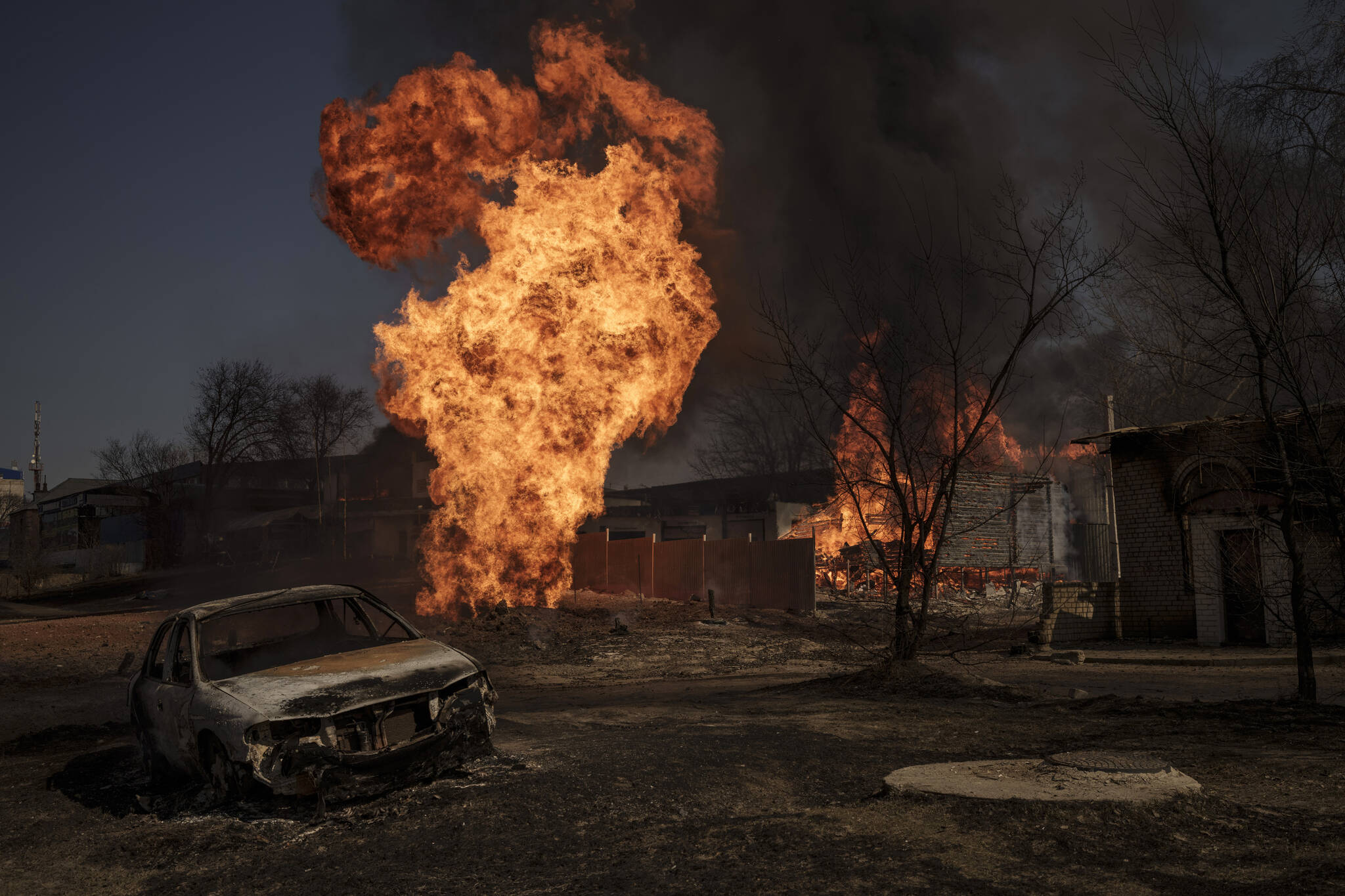 Flames and smoke rise from a fire following a Russian attack in Kharkiv, Ukraine, Friday, March 25, 2022. (AP Photo/Felipe Dana)