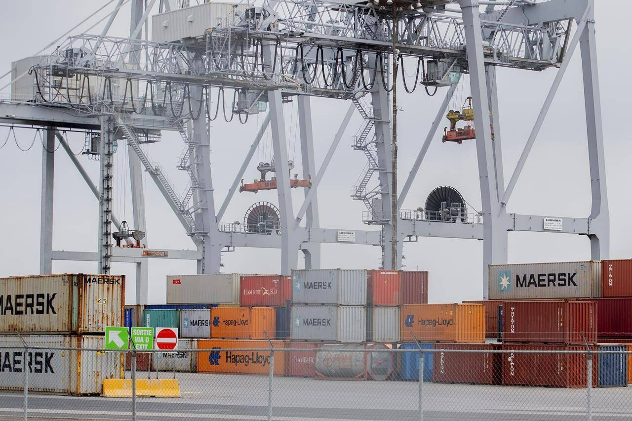 Shipping containers are shown at the Port of Montreal, Sunday, April 25, 2021.Statistics Canada says the country’s merchandise trade surplus narrowed in February as imports rose at a faster pace than exports. THE CANADIAN PRESS/Graham Hughes