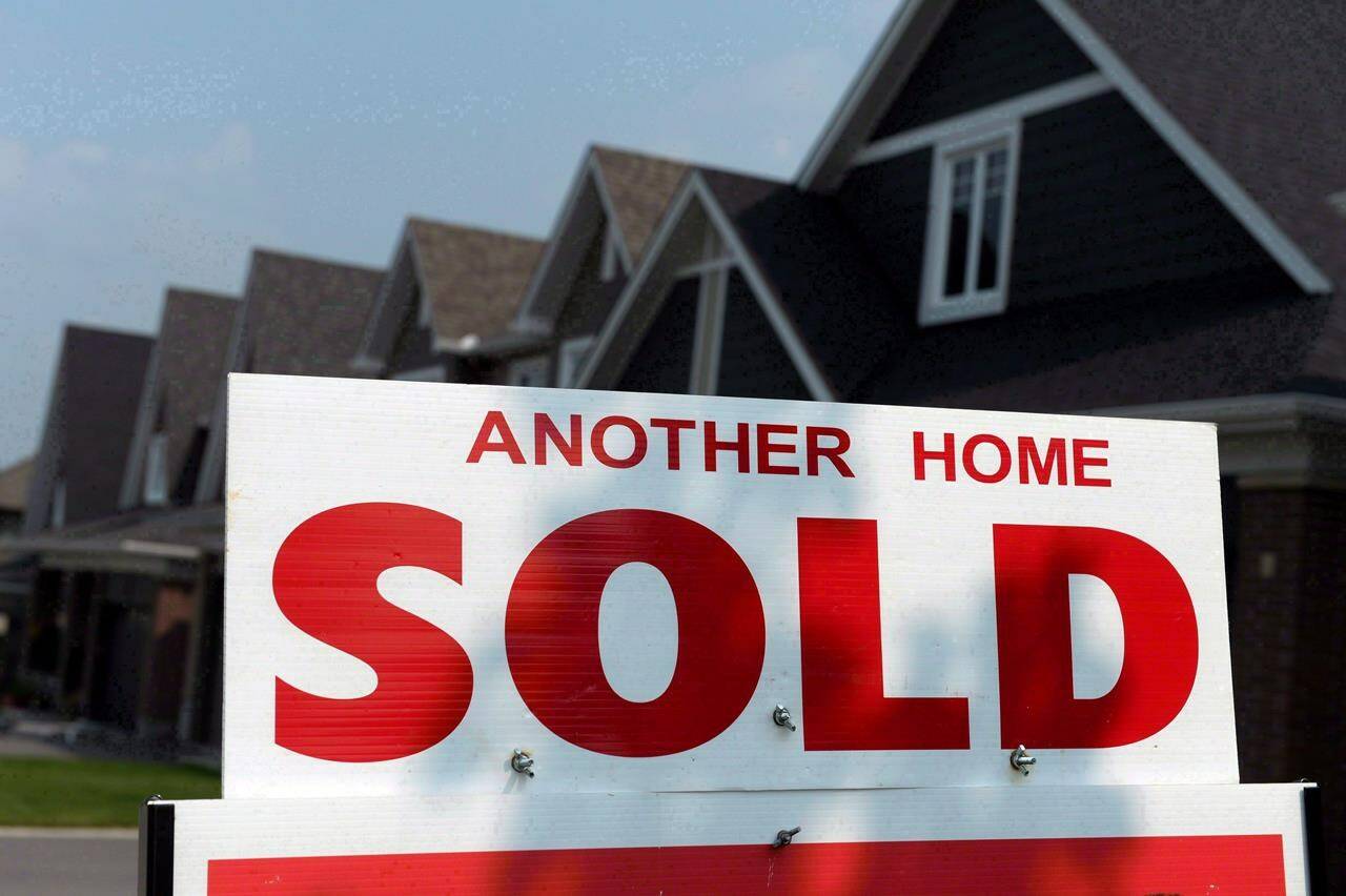 A for sale sign displays a sold home in a development in Ottawa on July 6, 2015. Earlier this month, the Liberal government unveiled a new mechanism for Canadians looking to save for a down payment on their first home: a fresh tax-free savings account.THE CANADIAN PRESS/Sean Kilpatrick