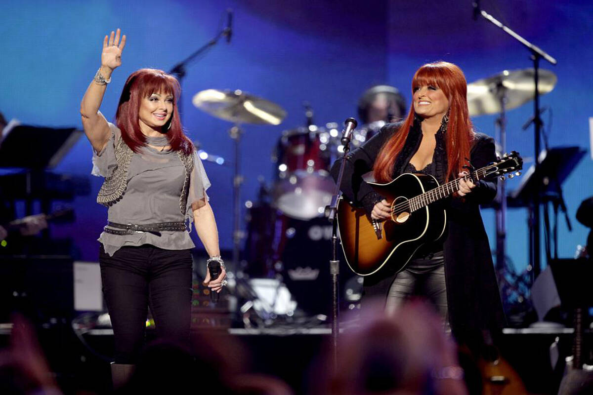 Naomi Judd, left, and Wynonna Judd, of The Judds, perform at the “Girls’ Night Out: Superstar Women of Country,” in Las Vegas, April 4, 2011. Naomi Judd, the Kentucky-born matriarch of the Grammy-winning duo The Judds and mother of Wynonna and Ashley Judd, has died, her family announced Saturday, April 30, 2022. She was 76. (AP Photo/Julie Jacobson, File)