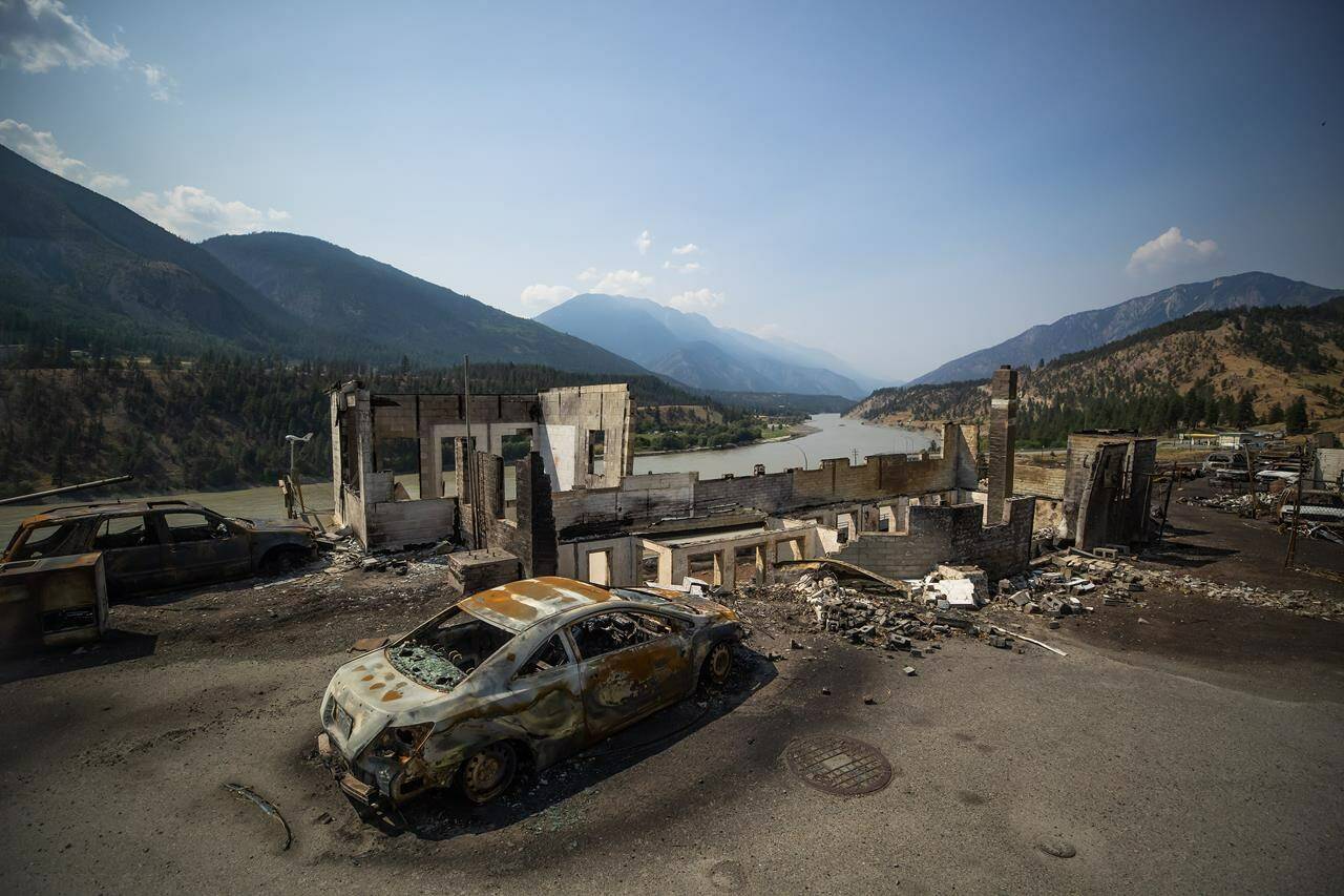 Burned cars and structures are seen in Lytton, B.C., on Friday, July 9, 2021, after a wildfire destroyed most of the village on June 30. A report on the wildfire concludes the disaster couldn’t have been stopped, even with an area-wide emergency response.THE CANADIAN PRESS/Darryl Dyck