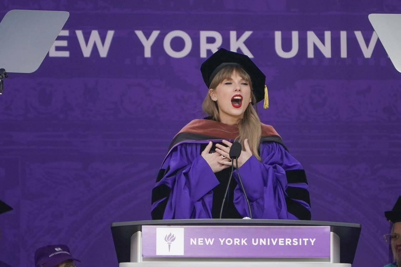 Taylor Swift speaks during a graduation ceremony for New York University at Yankee Stadium in New York, Wednesday, May 18, 2022. (AP Photo/Seth Wenig)