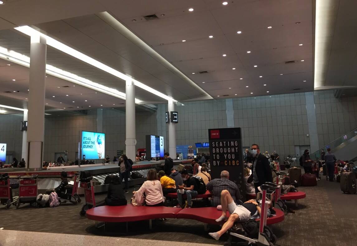 Travellers waiting for their luggage. (Carla Leinweber/Submitted)