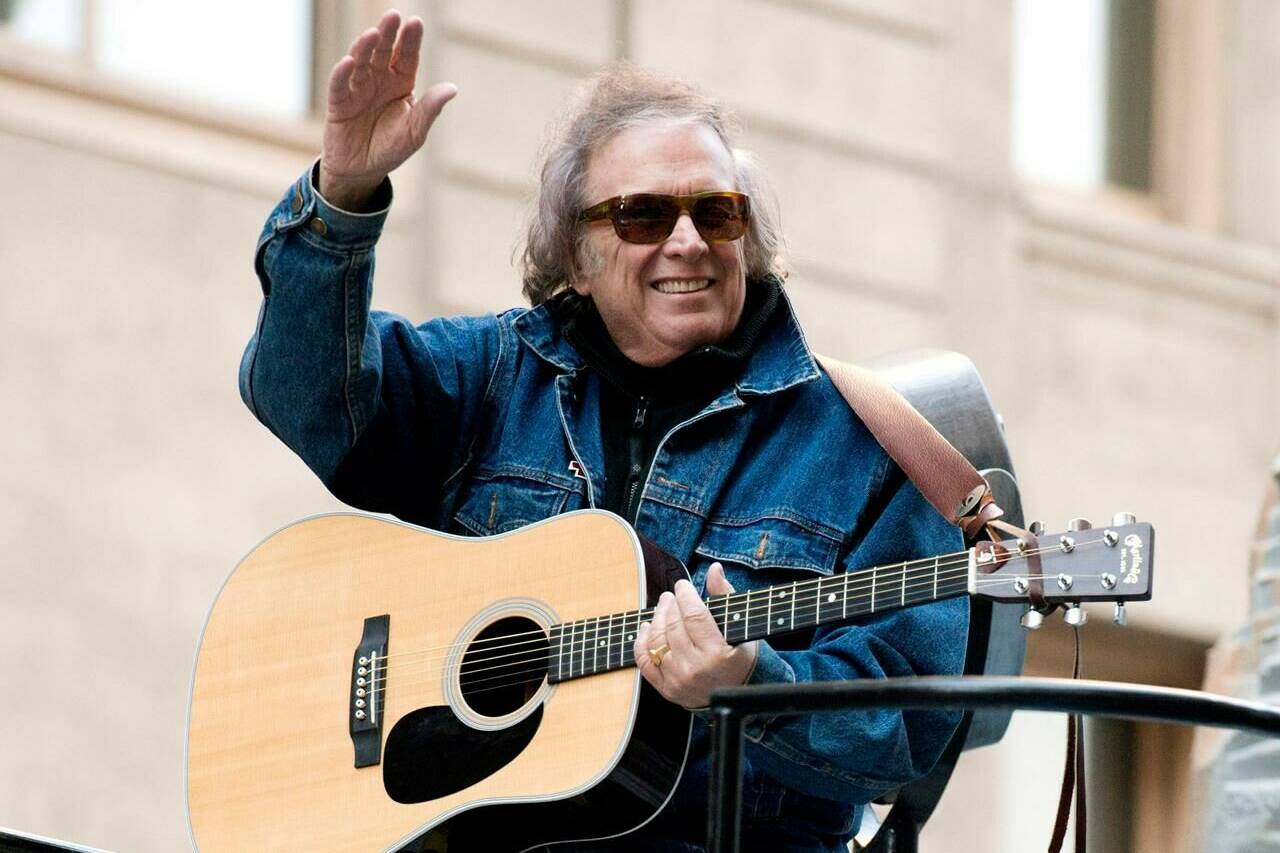 FILE - Don McLean rides a float in the Macy’s Thanksgiving Day Parade in New York. Feb. 22, 2019. For all those fans of the iconic song “American Pie” who have sometimes wondered about the lyrics they are singing loudly, singer-songwriter Don McLean shares the secrets in the new full-length feature documentary, “The Day the Music Died: The Story of Don McLean’s ‘American Pie.’”. (AP Photo/Charles Sykes, File)