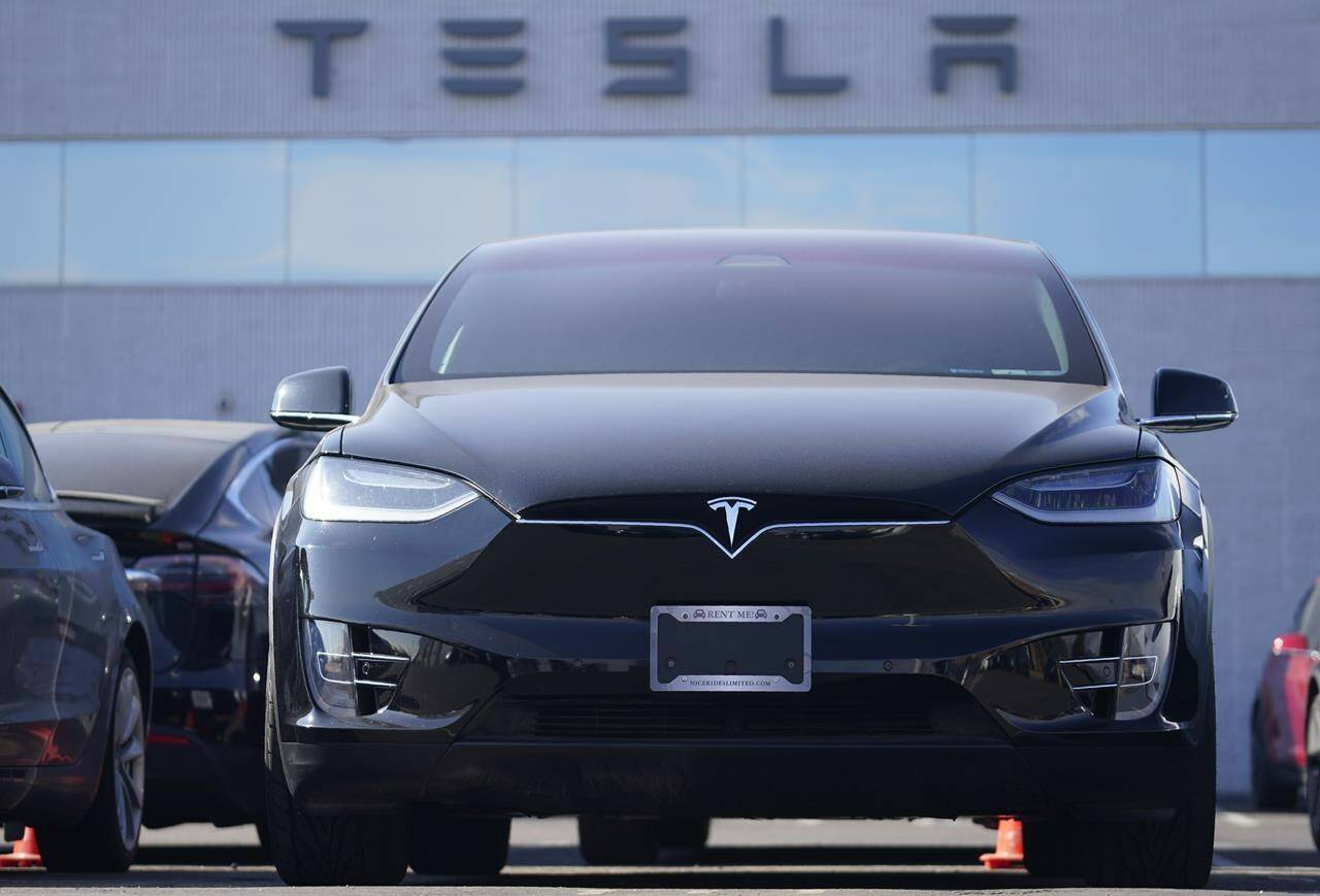 An unsold 2021 Model X sports-utility vehicle sits at a Tesla dealership Sunday, Jan. 24, 2021, in Littleton, Colo. A tax on yachts, luxury cars and private planes and helicopters, designed to hit super-rich, could also cover some electric and hybrid cars, tax experts are warning. THE CANADIAN PRESS AP/David Zalubowski