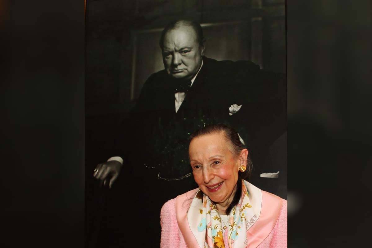 Estrellita Karsh wife of legenary photographer Yousuf Karsh stands in front of the iconic 1941 photograph of Winston Churchill taken by her husband in the Speaker of the House of Commons’ chambers on Tuesday July 14, 2009. THE CANADIAN PRESS/Fred Chartrand