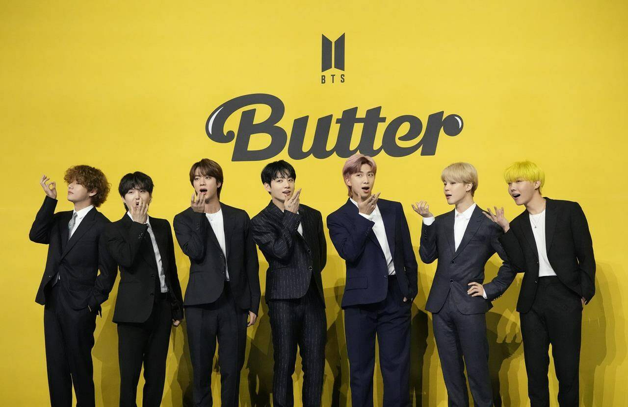 Members of South Korean K-pop band BTS, V, SUGA, JIN, Jung Kook, RM, Jimin, and j-hope from left to right, pose for photographers ahead of a press conference to introduce their new single “Butter” in Seoul, South Korea, Friday, May 21, 2021. South Korea may conduct a public survey to help determine whether to grant exemptions of the mandatory military service to members of the K-pop superstar boyband BTS, officials said Wednesday, Aug. 31, 2022.(AP Photo/Lee Jin-man, File)