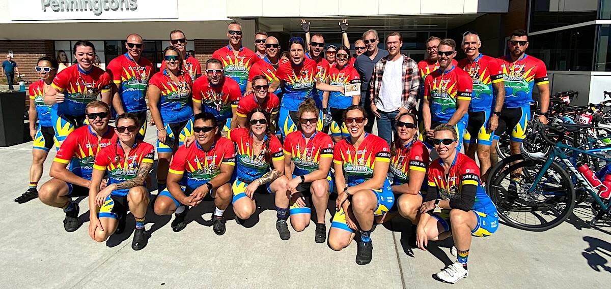 The 2022 Cops for Cancer Tour de Valley team, with Sgt. Krista Vrolyk holding the team’s framed $100 donation from Chilliwack man who lost $2,700. (Minon Daubigeon photo)