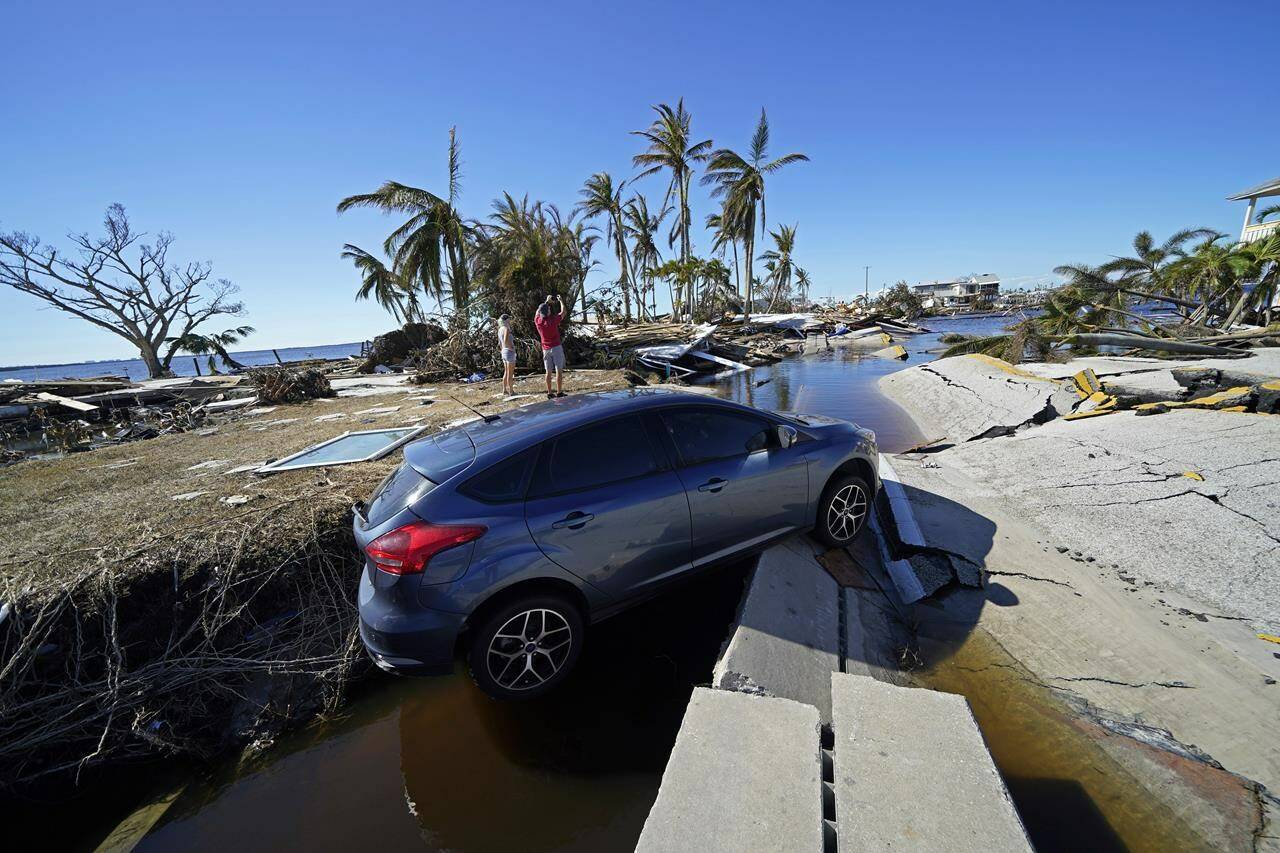 Destruction at the bridge leading to Pine Island is seen in the aftermath of Hurricane Ian in Matlacha, Fla., Sunday, Oct. 2, 2022. The only bridge to the island is heavily damaged so it can only be reached by boat or air. (AP Photo/Gerald Herbert)