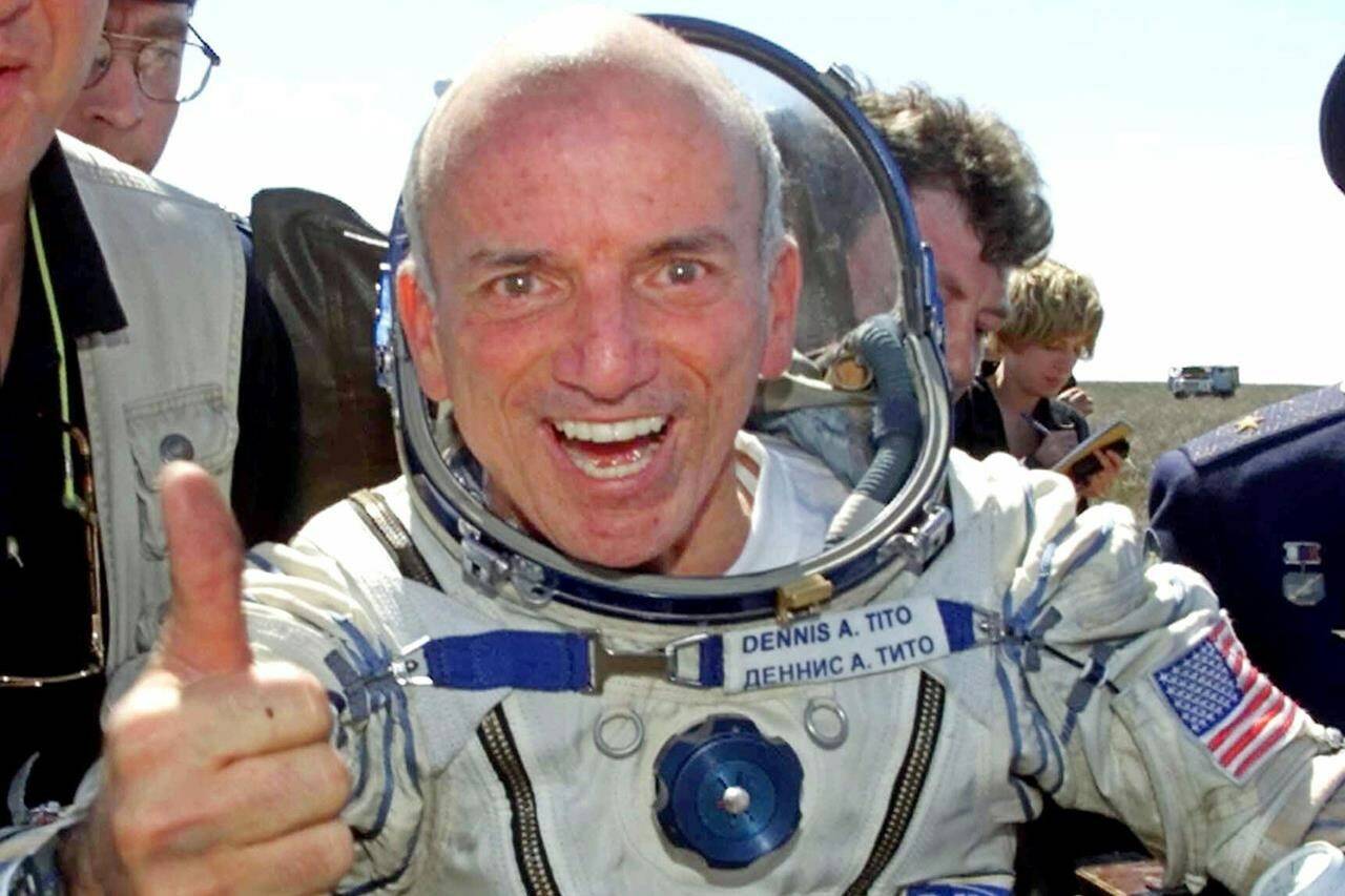 FILE - U.S. multimillionaire Dennis Tito gives a thumbs up shortly after his landing in the Central Asian steppes, 80 kilometers (50 miles) northeast of Arkalyk, Kazakstan on May 6, 2001. The world’s first space tourist has signed up to spin around the moon aboard Elon Musk’s Starship. For Dennis Tito, it’s a chance to relive the joy of his trip 21 years ago to the International Space Station. (AP Photo/Mikhail Metzel, File)