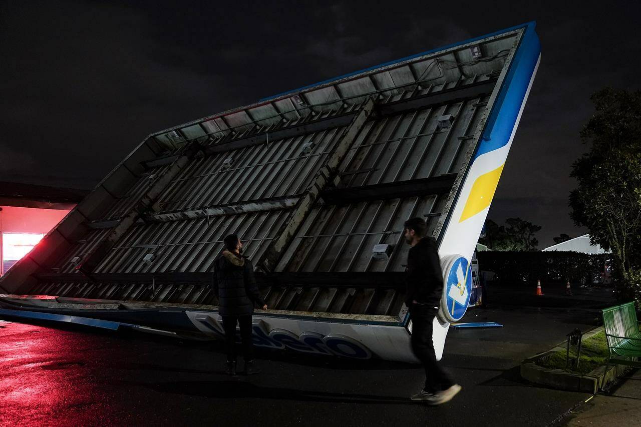 The canopy of gas station, toppled by strong winds, rests at an angle, Wednesday, Jan. 4, 2023, in South San Francisco. Another winter storm moved into California on Wednesday, walloping the northern part of the state with more rain and snow. It’s the second major storm of the week in the parched state. It follows storms that brought threats of flash flooding and severe thunderstorms across the southern U.S. and heavy snow in the upper Midwest. (AP Photo/Godofredo A. Vásquez)