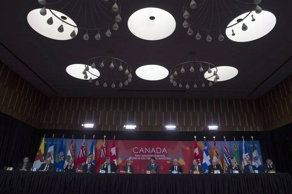 Canadian premiers listen to Prime Minister Justin Trudeau during the closing news conference at the First Ministers Meeting in Ottawa, Tuesday October 3, 2017. THE CANADIAN PRESS/Adrian Wyld