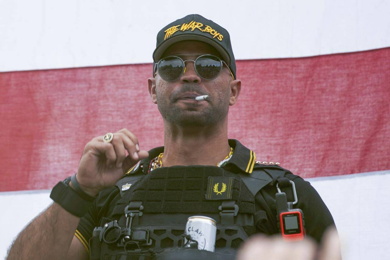 FILE - Proud Boys leader Henry “Enrique” Tarrio wears a hat that says The War Boys during a rally in Portland, Ore., on Sept. 26, 2020. A barrage of bickering between lawyers and the judge has bogged down the seditious conspiracy trial of former Proud Boys leader Enrique Tarrio and four associates. Defense attorneys have repeatedly argued in vain for the judge to declare a mistral. (AP Photo/Allison Dinner, File)