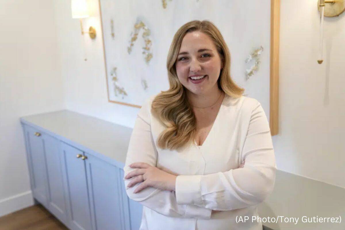 Paige Pritchard, a spending coach who shares financial advice on TikTok, poses for a photo in her home office, Thursday, Feb. 9, 2023, in Coppell, Texas. At a time when consumers are inundated with so-called social media influencers peddling the latest products online, a slew of TikTok users are leveraging their platforms to tell people what not to buy instead. Pritchard said she chose her career path after blowing her entire $60,000 salary on clothing, beauty and hair products in the first year after she graduated from college. (AP Photo/Tony Gutierrez)