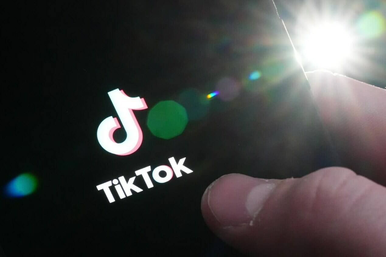 The TikTok startup page is displayed on an iPhone in Ottawa on Monday, Feb. 27, 2023. The House of Commons announced on Tuesday that it’s banning the application from all House-managed devices, effective March 3, 2023. THE CANADIAN PRESS/Sean Kilpatrick