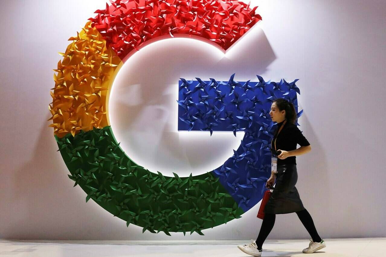 A woman walks past the logo for Google at the China International Import Expo in Shanghai, Monday, Nov. 5, 2018. The head of the Canadian Chamber of Commerce says a Liberal committee motion seeking internal documents from Google and Meta, the parent company of Facebook and Instagram, is “undemocratic.” THE CANADIAN PRESS/AP-Ng Han Guan
