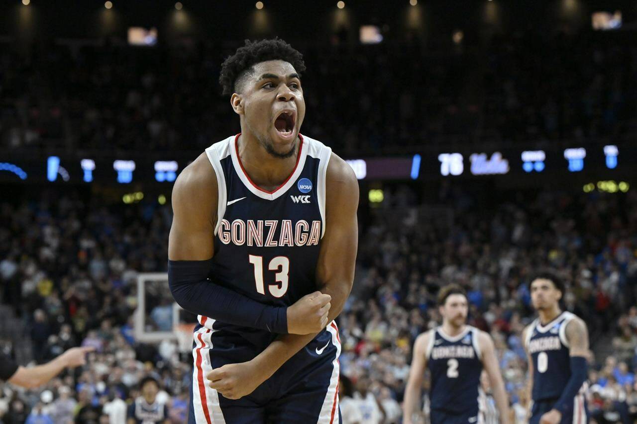 Gonzaga’s Malachi Smith (13) celebrates in the second half of a Sweet 16 college basketball game against UCLA in the West Regional of the NCAA Tournament, Thursday, March 23, 2023, in Las Vegas. (AP Photo/David Becker)