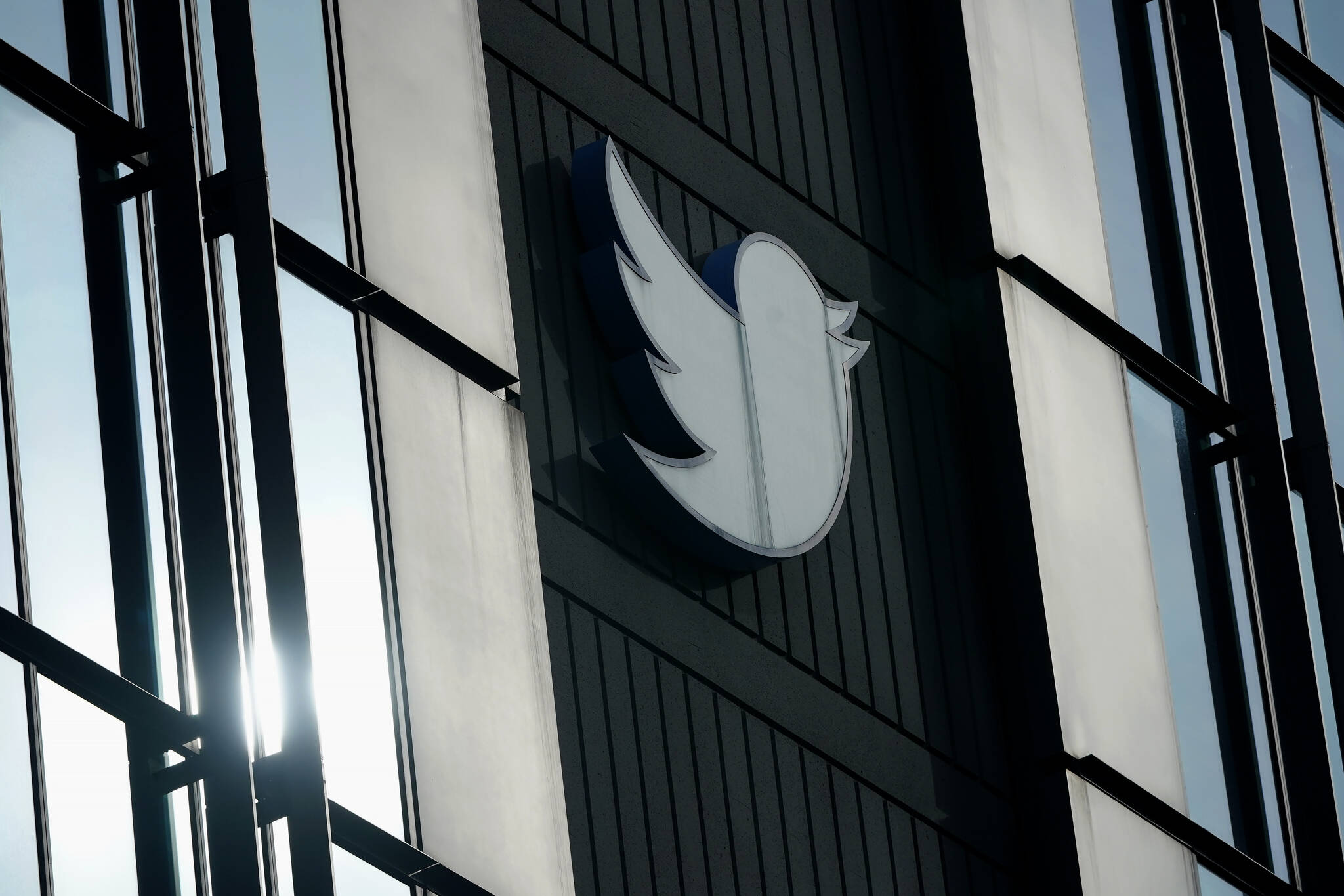 A Twitter logo hangs outside the company’s offices in San Francisco, on Dec. 19, 2022. Twitter has labeled National Public Radio (NPR) as “state-affiliated media” on the social media site Wednesday, April 5, 2023, a move some worried could undermine public confidence in the news organization. (AP Photo/Jeff Chiu, File)