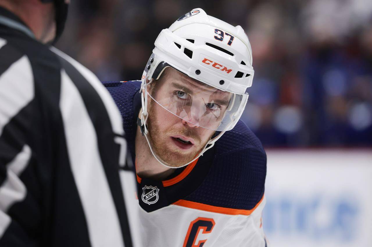 Edmonton Oilers’ Connor McDavid lines up for a faceoff against the Vancouver Canucks during the third period of an NHL hockey game in Vancouver, on Tuesday, January 25, 2022. Hockey superstar McDavid and the “Degrassi” franchise are among this year’s inductees to Canada’s Walk of Fame. THE CANADIAN PRESS/Darryl Dyck