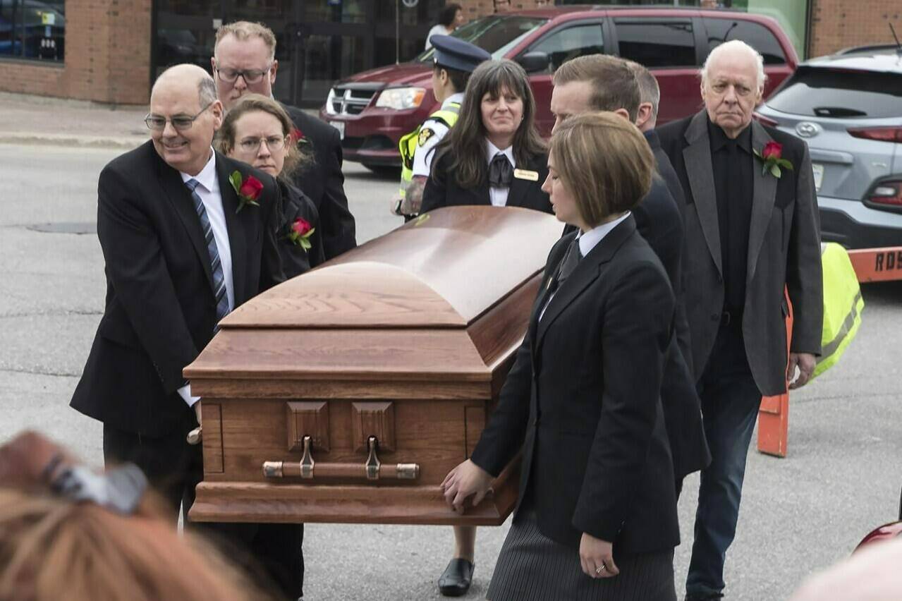 Family members carry the casket of Gordon Lightfoot into St. Paul’s United Church, in his hometown of Orillia, Ont., Sunday, May 7, 2023. The folk singer-songwriter died May 1 at the age of 84. THE CANADIAN PRESS/Fred Thornhill