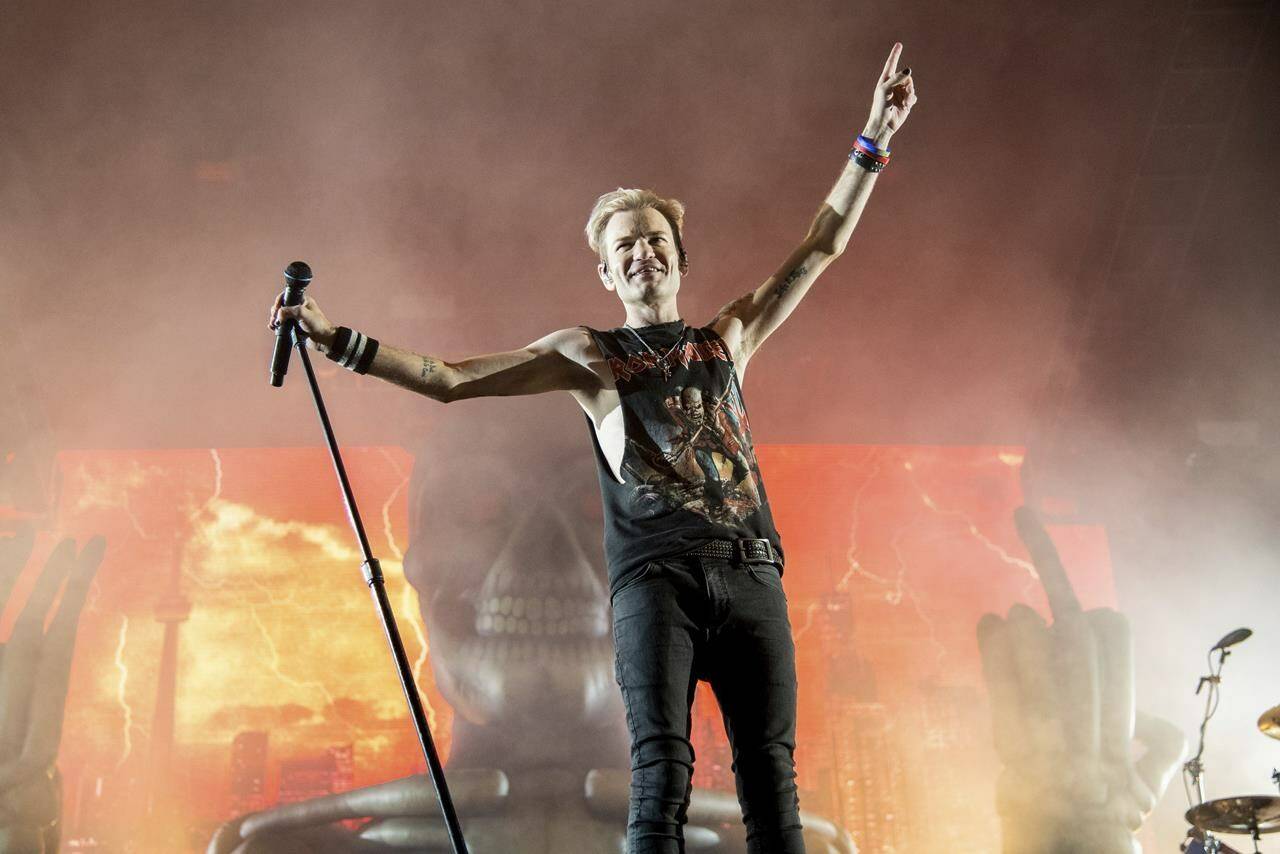 Deryck Whibley of Sum 41 performs during a concert in Quebec City on Friday, July 15, 2022. Canadian pop-punk band Sum 41 will split up following the release of their final album and a farewell world tour. THE CANADIAN PRESS/AP-Photo by Amy Harris/Invision/AP