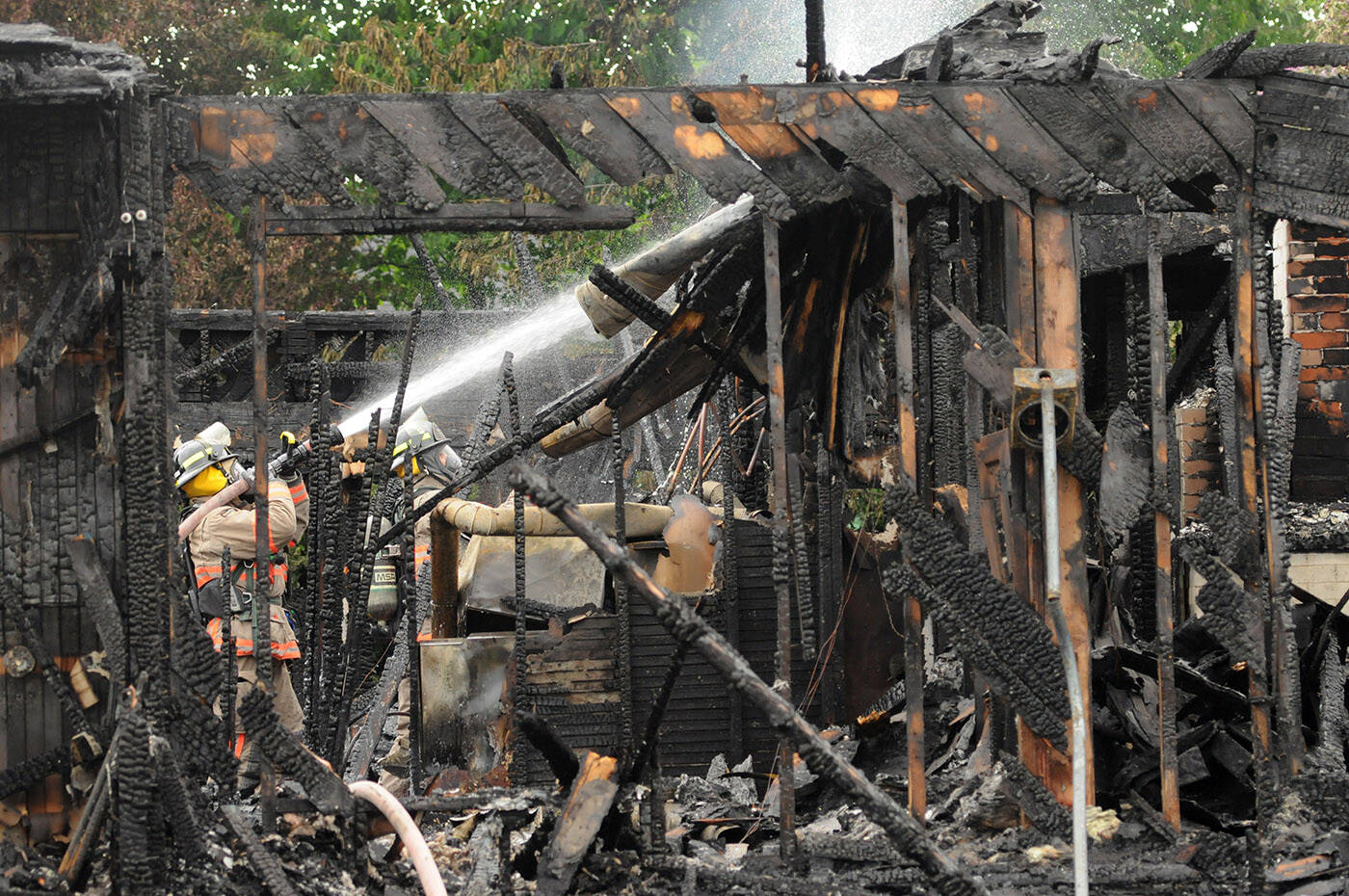 The house where Daniel Hackl allegedly engaged in an hours-long standoff with RCMP on Victoria Day burned to the ground the same night he was arrested. Hackl has made one strange court appearance and refused to appear for another since being detained. (Jenna Hauck/ Chilliwack Progress)