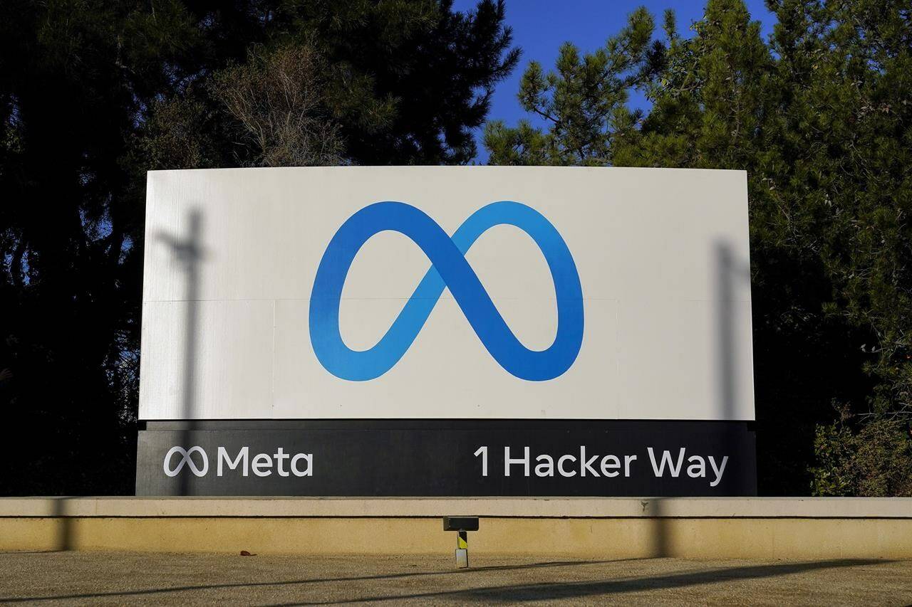 Meta’s logo can be seen on a sign at the company’s headquarters in Menlo Park, Calif., Nov. 9, 2022. Meta has started blocking news for some Canadians on its Facebook and Instagram platforms in response to a Liberal government bill that is currently being studied in the Senate.THE CANADIAN PRESS/AP/Godofredo A. Vásquez