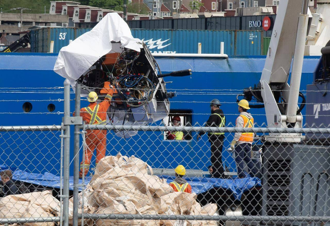 Debris from the Titan submersible, recovered from the ocean floor near the wreck of the Titanic, is unloaded from the ship Horizon Arctic at the Canadian Coast Guard pier in St. John’s on Wednesday, June 28, 2023. The company behind the submersible that imploded during a recent dive to the Titanic ignored key principles that guide organizations working in high-risk environments, experts in emergency management say. THE CANADIAN PRESS/Paul Daly