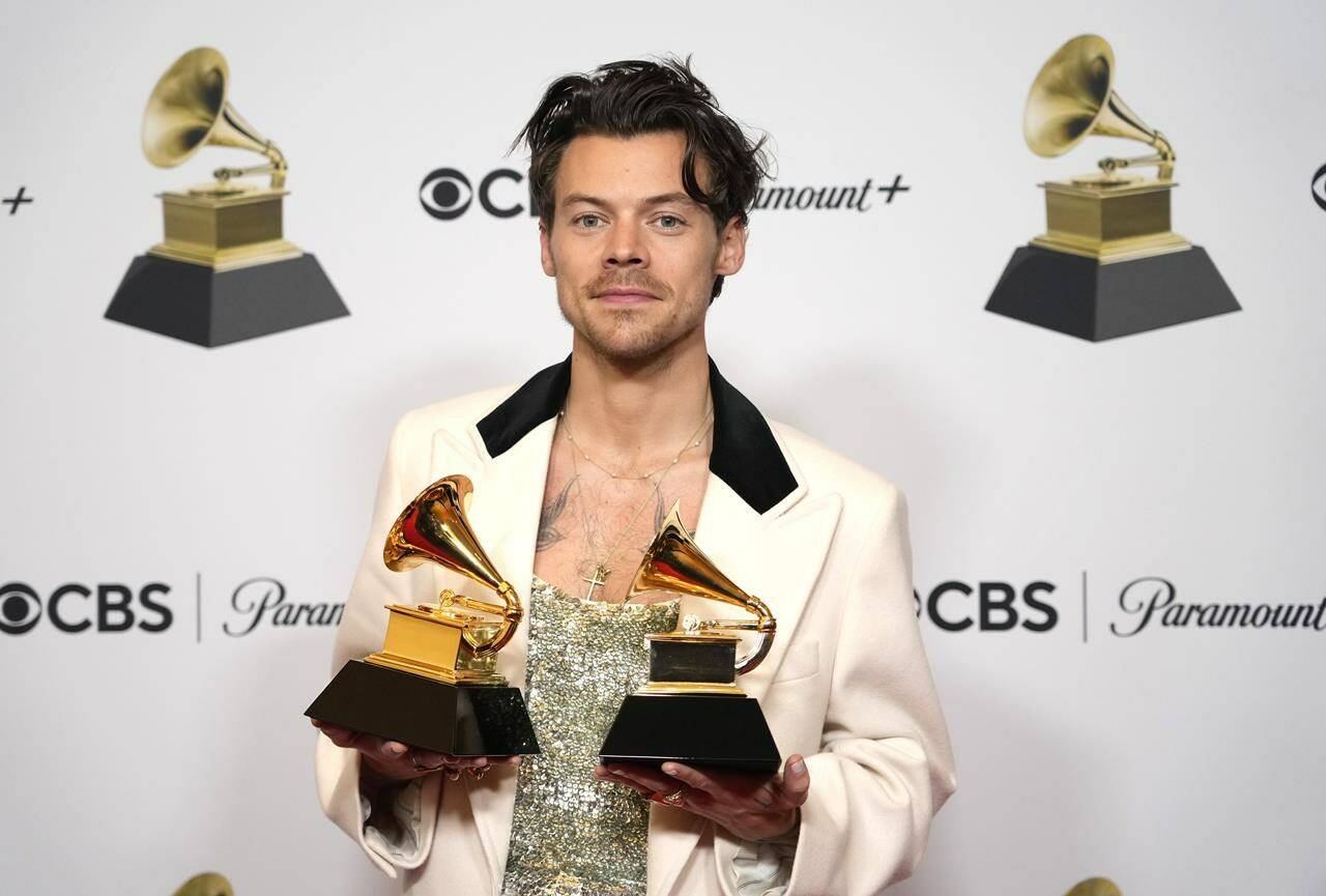 Harry Styles, winner of the award for album of the year for “Harry’s House” and best pop vocal album for “Harry’s House,” poses in the press room at the 65th annual Grammy Awards on Sunday, Feb. 5, 2023, in Los Angeles. (AP Photo/Jae C. Hong)