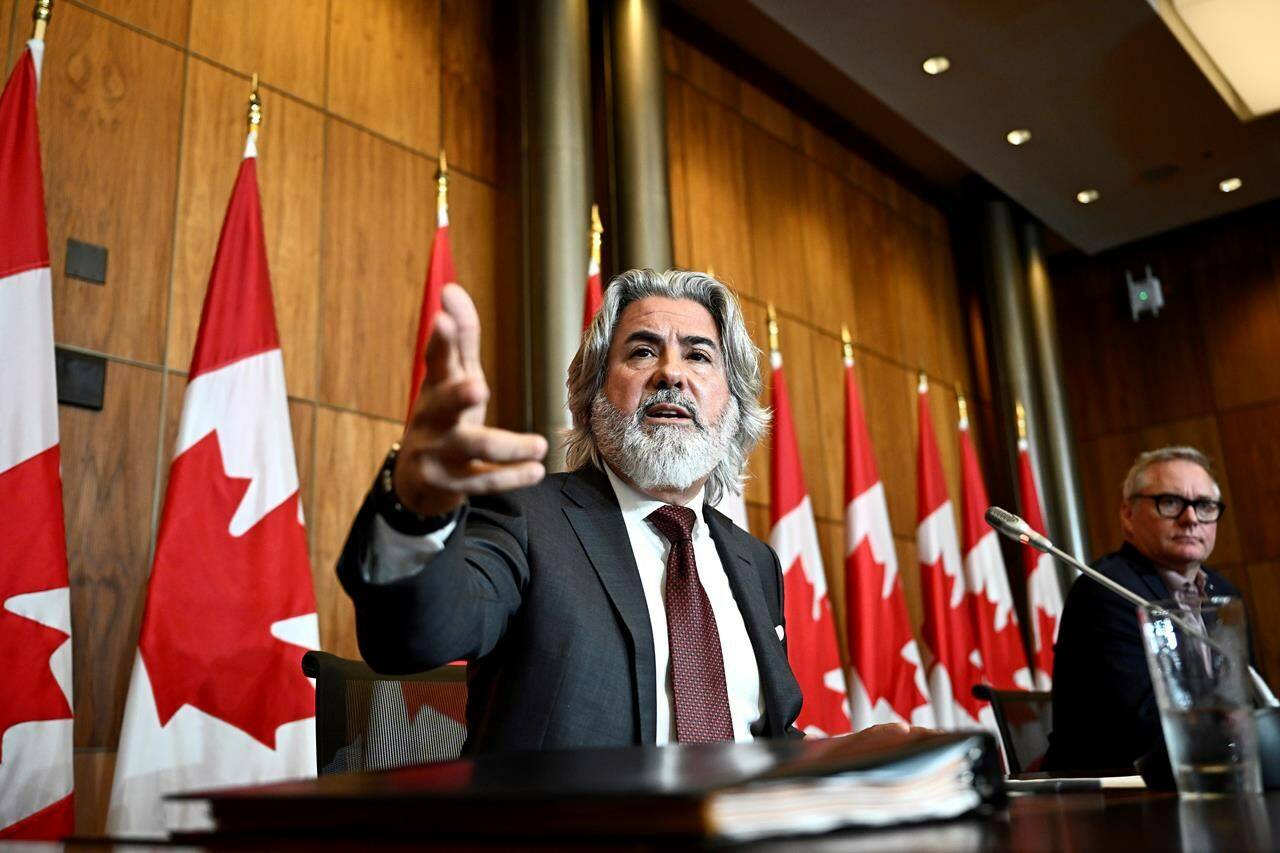 Minister of Canadian Heritage Pablo Rodriguez speaks during a news conference on Bill C-18, the Online News Act, along Bloc MP Martin Champoux, right, in Ottawa, on Wednesday, July 5, 2023. THE CANADIAN PRESS/Justin Tang