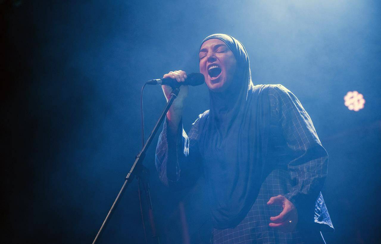 FILE - Irish singer Sinead O’Connor performs at Akvarium Klub in Budapest, Hungary, Dec. 9, 2019. O’Connor, the gifted Irish singer-songwriter who became a superstar in her mid-20s but was known as much for her private struggles and provocative actions as for her fierce and expressive music, has died at 56. The singer’s family issued a statement reported Wednesday by the BBC and RTE. (Marton Monus/MTI via AP, File)