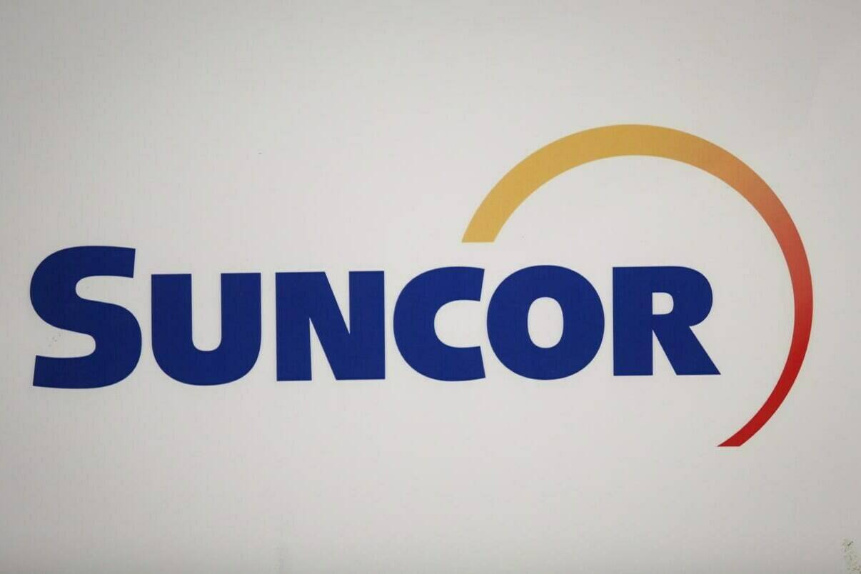 A Suncor Energy Inc. logo is shown at the company’s annual meeting in Calgary on Thursday, April 27, 2017. The federal government is trying to reclaim $347 million in insurance paid to Suncor in the wake of political unrest in Libya. THE CANADIAN PRESS/Jeff McIntosh