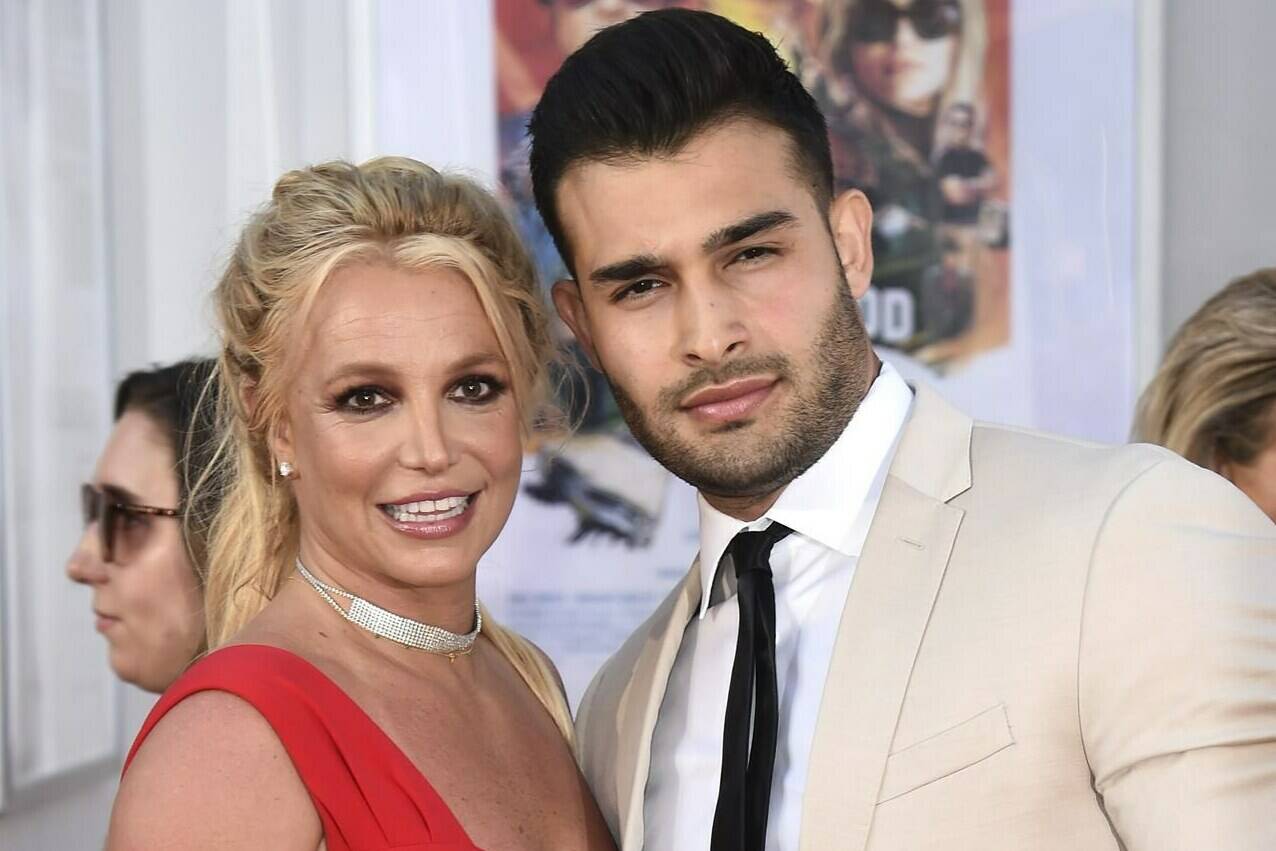 FILE - Britney Spears and Sam Asghari appear at the Los Angeles premiere of “Once Upon a Time in Hollywood” on July 22, 2019. Asghari has filed for divorce from Spears, a person familiar with the filing said late Wednesday, Aug. 16, 2023. The person, who is close to Asghari but not authorized to speak publicly, confirmed the filing happened Wednesday, hours after several outlets including TMZ and People magazine reported the couple had separated. (Photo by Jordan Strauss/Invision/AP, File)