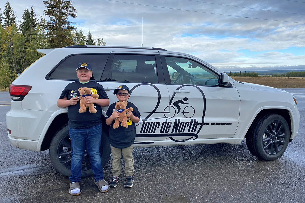 Avery and his older brother Seb at Cops for Cancer Tour de North in 2021. Avery recently celebrated four years cancer free, and his dad John Togyi now volunteers with the annual fundraiser for pediatric cancer research and support services.