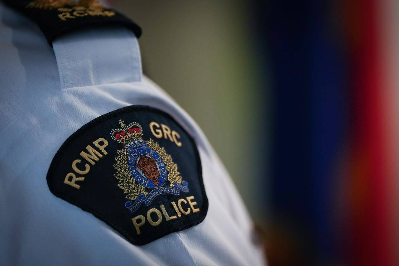 An RCMP patch is seen on the shoulder of an assistant commissioner, in Surrey, B.C., on Friday, April 28, 2023. North Vancouver RCMP is warning both teens and adults to be aware of ongoing online sexual extortions, while also excouraging parents to talk with their children about the dangers of these scams. THE CANADIAN PRESS/Darryl Dyck