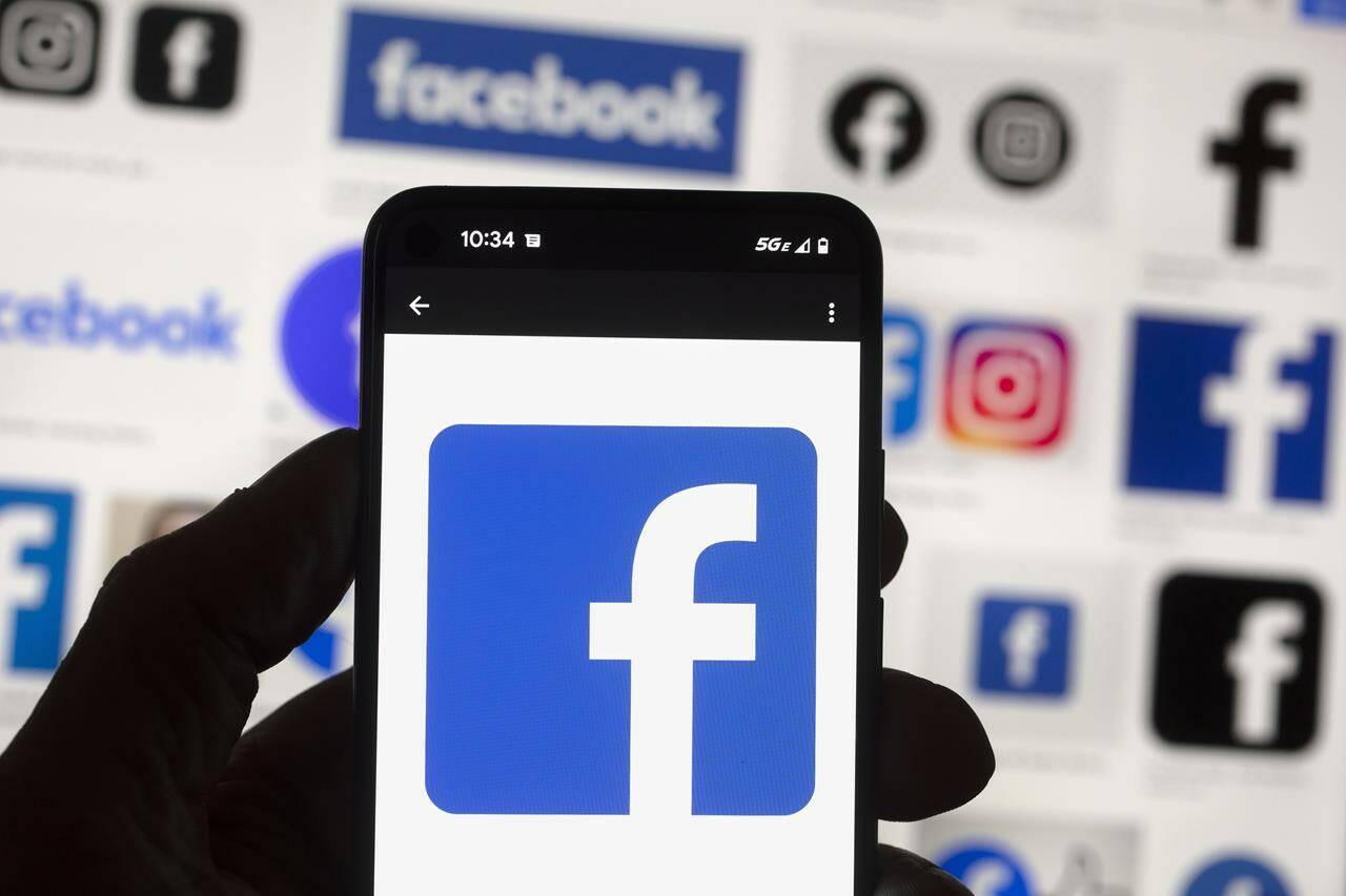 Some news outlets say they’ve been unable to post on Meta’s social media sites some or all of the time since the digital giant began rolling out its restrictions on Canadian news. The Facebook logo is seen on a cellphone in Boston, Oct. 14, 2022. THE CANADIAN PRESS/AP-Michael Dwyer